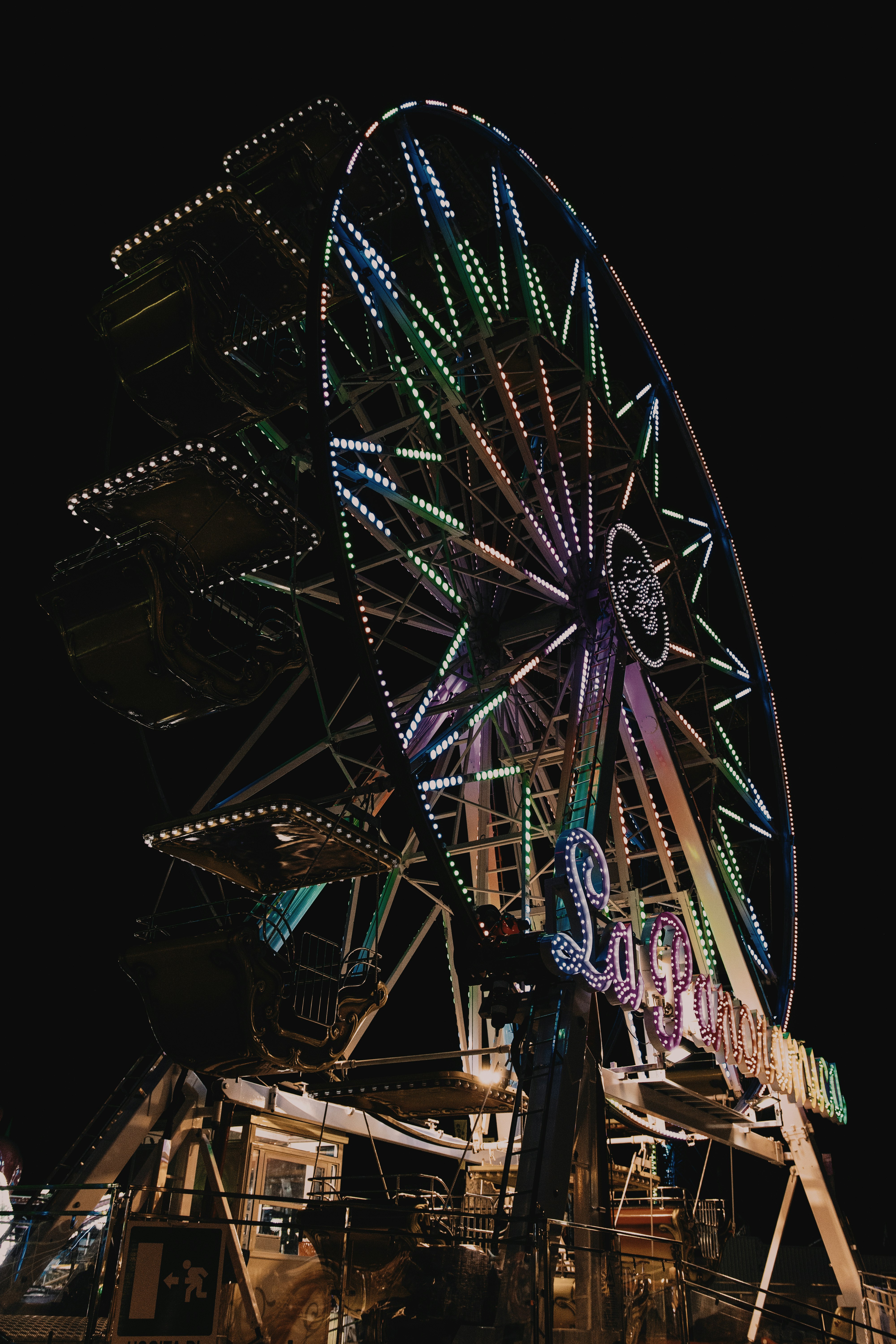 ferris wheel with lights turned on during night time